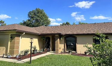 Residential Home with an Brownwood Asphalt Shingle Roof replacement in Lakeland, FL.