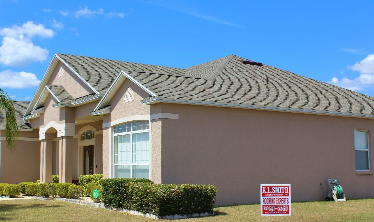 Residential Home with an Driftwood Asphalt Shingle Roof replacement in Lakeland, FL.