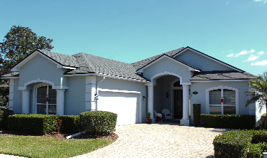 Residential Home with an Estate Grey Asphalt Shingle Roof replacement in Lakeland, FL.