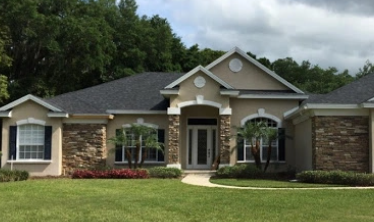 Residential Home with an Onyx Black Asphalt Shingle Roof replacement in Lakeland, FL.