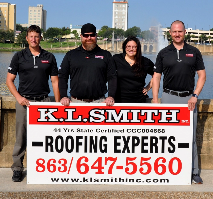 KL Smith Team with the KL Smith Business Sign
