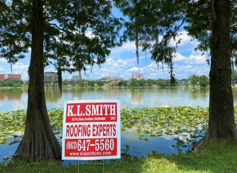 Roofing service advertisement by K.L. Smith Inc. in a scenic Lakeland, Florida, park with a waterfront view and lush greenery.