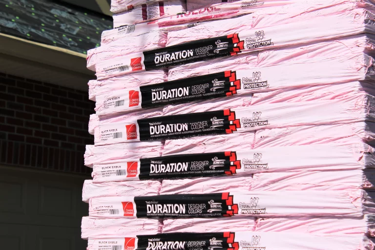 Stacks of Owens Corning Duration designer shingles ready for eco-friendly and efficient roof replacement by Florida-based roofing experts.